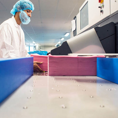 factory worker stacking wafer paper