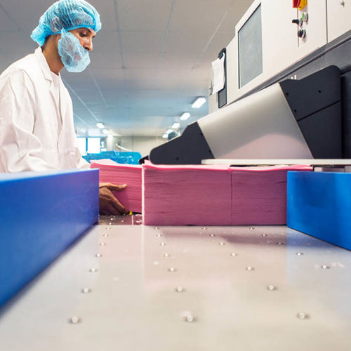 factory worker stacking wafer paper