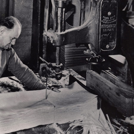 Factory worker sawing wafer paper sheets